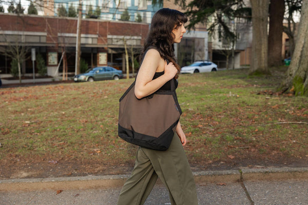 A person carrying a Swift over their shoulder
